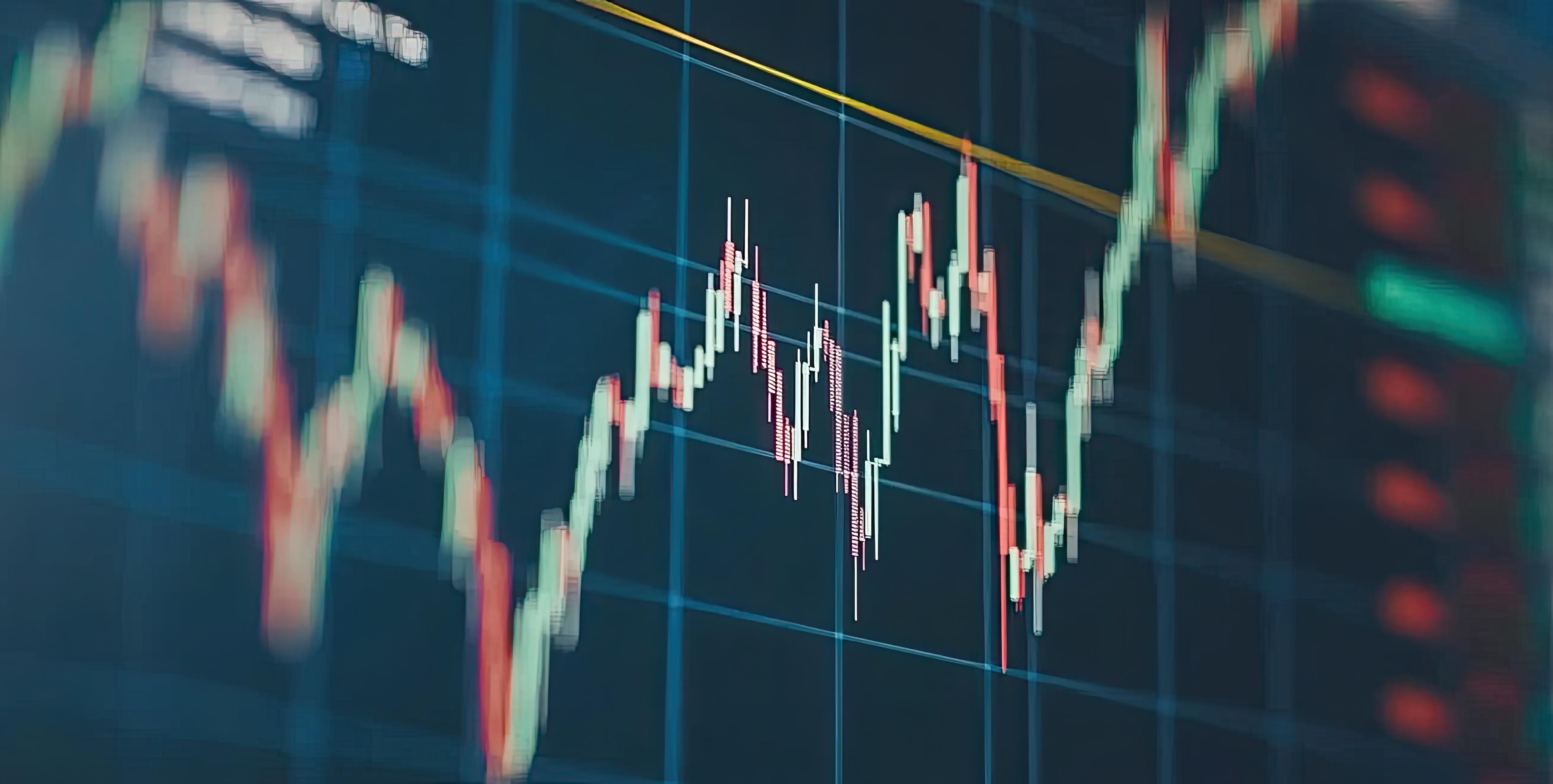 Trader reviewing market charts on a transparent screen